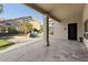 Spacious back patio with travertine flooring, pool, and outdoor entertainment area at 3102 E Desert Broom Way, Phoenix, AZ 85048