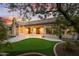 Backyard with a putting green, covered patio, and desert landscaping at 3102 E Desert Broom Way, Phoenix, AZ 85048