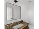 Bathroom features granite countertop, modern fixtures, with clean white walls at 3102 E Desert Broom Way, Phoenix, AZ 85048
