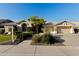 Charming exterior of home featuring a well-maintained lawn, inviting curb appeal, and a spacious garage at 3102 E Desert Broom Way, Phoenix, AZ 85048