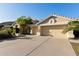 Spacious two-car garage with ample parking and driveway space, set in a well-maintained home exterior at 3102 E Desert Broom Way, Phoenix, AZ 85048