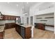 Spacious kitchen features an island, stainless steel appliances, and rich wood cabinets at 3102 E Desert Broom Way, Phoenix, AZ 85048