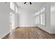 Bright, airy living room featuring hardwood floors and shuttered windows at 3102 E Desert Broom Way, Phoenix, AZ 85048