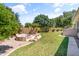 A well-maintained backyard offers a tranquil setting with a built-in fire pit and lush greenery at 3225 E Cardinal Ct, Chandler, AZ 85286