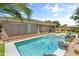 A tranquil backyard pool offers an oasis for relaxation and recreation, surrounded by lush landscaping at 3225 E Cardinal Ct, Chandler, AZ 85286