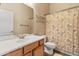 Bright bathroom with tiled flooring, white countertop vanity, and decorative shower curtain at 3225 E Cardinal Ct, Chandler, AZ 85286