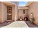 Charming courtyard featuring decorative pots, stone flooring, and a secure entry gate at 3225 E Cardinal Ct, Chandler, AZ 85286