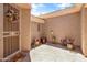 Beautiful courtyard with a security door, potted plants, and a decorative stone patio at 3225 E Cardinal Ct, Chandler, AZ 85286