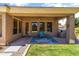 Outdoor patio with a ceiling fan, a blue rug and comfortable seating for entertaining at 3225 E Cardinal Ct, Chandler, AZ 85286