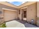 Inviting courtyard with stone flooring, a decorative gate, and access to the garage at 3225 E Cardinal Ct, Chandler, AZ 85286