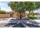 Well-maintained home with desert landscaping, a gated entrance, and neutral exterior paint at 3225 E Cardinal Ct, Chandler, AZ 85286