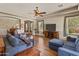 Spacious living room featuring hardwood floors, a ceiling fan, and lots of natural light at 3225 E Cardinal Ct, Chandler, AZ 85286