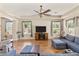 Open and airy living room with hardwood floors and a ceiling fan at 3225 E Cardinal Ct, Chandler, AZ 85286