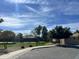 Landscaped neighborhood with green spaces, mature trees, and well-maintained street at 3225 E Cardinal Ct, Chandler, AZ 85286