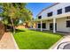 Lush backyard with a covered patio, perfect for outdoor entertaining and relaxing at 3444 E Flamingo Ct, Gilbert, AZ 85297