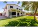 Large covered patio overlooking a spacious backyard with artificial turf at 3444 E Flamingo Ct, Gilbert, AZ 85297