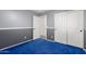 Bedroom with two-tone walls, blue carpet, and double closet at 3444 E Flamingo Ct, Gilbert, AZ 85297