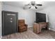 Bedroom featuring Fort Knox safe, ceiling fan, and mounted TV at 3444 E Flamingo Ct, Gilbert, AZ 85297