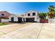 Two-story home featuring a three-car garage and well-manicured landscaping at 3444 E Flamingo Ct, Gilbert, AZ 85297