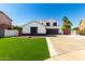 Charming two-story home with manicured front yard and a two-car garage at 3444 E Flamingo Ct, Gilbert, AZ 85297