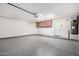 Well-maintained garage featuring storage cabinets, epoxy floors, and ample lighting at 3444 E Flamingo Ct, Gilbert, AZ 85297