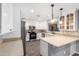 Bright kitchen features stainless steel appliances, white cabinetry, stylish countertops, and decorative backsplash at 3444 E Flamingo Ct, Gilbert, AZ 85297