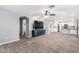 Open living area features a ceiling fan and wood-look floors at 3444 E Flamingo Ct, Gilbert, AZ 85297