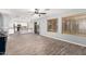 Open-concept living area with wood-look floors and sliding glass doors at 3444 E Flamingo Ct, Gilbert, AZ 85297