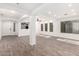 Open living space with wood-look flooring, open doorway and natural light at 3444 E Flamingo Ct, Gilbert, AZ 85297