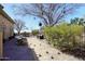 Backyard featuring a bocce ball court surrounded by desert landscaping at 36674 N Vasari Dr, Scottsdale, AZ 85262