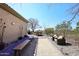 Backyard featuring a bocce ball court, outdoor seating area, and desert landscaping at 36674 N Vasari Dr, Scottsdale, AZ 85262