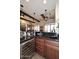 Bar area features wine storage, wood cabinets, and sleek granite countertops at 36674 N Vasari Dr, Scottsdale, AZ 85262