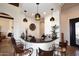 Stylish bar area featuring pendant lighting, dark countertops, and seating at 36674 N Vasari Dr, Scottsdale, AZ 85262