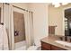 Bathroom featuring tile shower with recessed shelf, toilet and vanity with granite countertop at 36674 N Vasari Dr, Scottsdale, AZ 85262