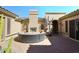 Charming courtyard with a fireplace, outdoor seating, and decorative accents for elegant outdoor living at 36674 N Vasari Dr, Scottsdale, AZ 85262