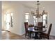 Cozy dining area featuring a chandelier, neutral walls, and natural lighting creating an inviting space at 36674 N Vasari Dr, Scottsdale, AZ 85262