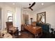 Stylish office with unique decor, including a statement ceiling fan and custom furnishings at 36674 N Vasari Dr, Scottsdale, AZ 85262