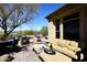 Relaxing outdoor patio featuring a cozy lounge area, built in BBQ and desert views at 36674 N Vasari Dr, Scottsdale, AZ 85262