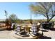 Outdoor living area with firepit, desert landscape, and BBQ at 36674 N Vasari Dr, Scottsdale, AZ 85262