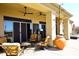 Covered outdoor seating area featuring comfortable seating, ceiling fans, and desert landscaping at 36674 N Vasari Dr, Scottsdale, AZ 85262