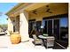 Covered outdoor seating area featuring comfortable seating and desert landscaping at 36674 N Vasari Dr, Scottsdale, AZ 85262