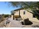 Back patio featuring comfortable outdoor seating with desert views and tiled patio at 36674 N Vasari Dr, Scottsdale, AZ 85262