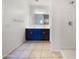 Bright bathroom featuring a double sink vanity, tiled floors, and walk-in shower at 42099 W Balsa Dr, Maricopa, AZ 85138