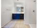 Bathroom with double vanity, granite countertops, and a glass-enclosed shower at 42099 W Balsa Dr, Maricopa, AZ 85138