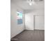 Bedroom with a ceiling fan, closet with sliding doors and a window at 42099 W Balsa Dr, Maricopa, AZ 85138