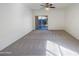 Bedroom with ceiling fan and glass sliding door to backyard at 42099 W Balsa Dr, Maricopa, AZ 85138