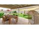 Outdoor patio features a dining table and seating area with artificial grass at 4410 S Grandview Ave, Tempe, AZ 85282