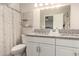 Bathroom with a double sink vanity, granite countertops, new fixtures and updated mirror at 4410 S Grandview Ave, Tempe, AZ 85282