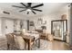 Charming dining room with a wooden table, upholstered chairs, and stylish decor accents with warm natural light at 4410 S Grandview Ave, Tempe, AZ 85282