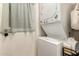 Efficient laundry area with stacked washer and dryer unit and functional storage at 4410 S Grandview Ave, Tempe, AZ 85282
